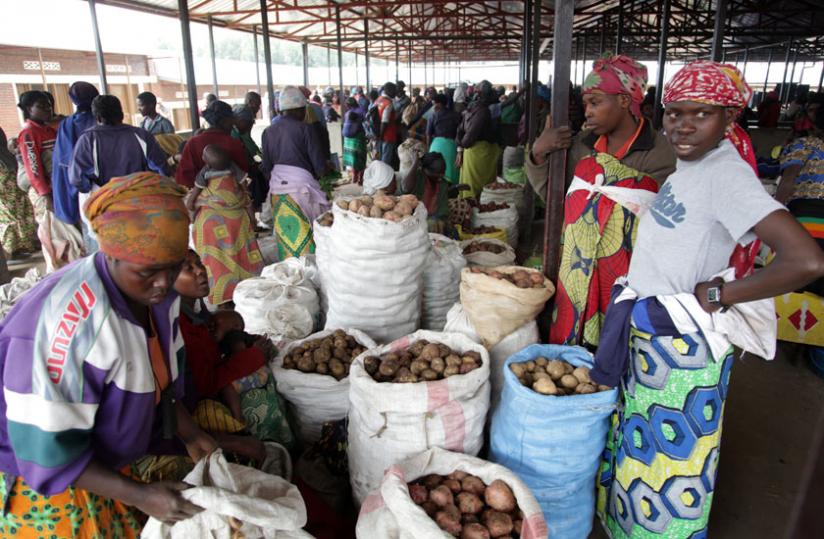 Women sell potatoes in Byangabo market in Musanze District in May. (File)