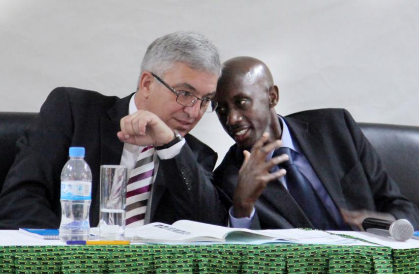 Local Government ministers Francis Kaboneka (R) and Roger Lewentz, the Rhineland minister for interior, sports, culture and infrastructure, chat during a meeting in Kigali yesterday. (John Mbanda)