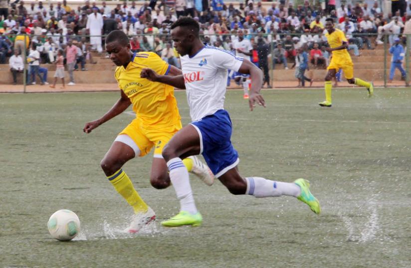 Rayon Sports new signing Peter Otema (R) scored the first goal for the Blues. The game ended 5 - 0 in favour of Rayon Sports. (John Mbanda)