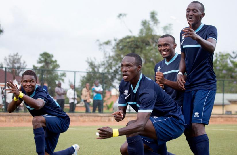 Gabriel Mugabo (C) celebrates with his teammates after scoring Policeu00e2u20acu2122s fourth goal in the 5-0 win against Kiyovu on Wednesday. (Timothy Kisambira)
