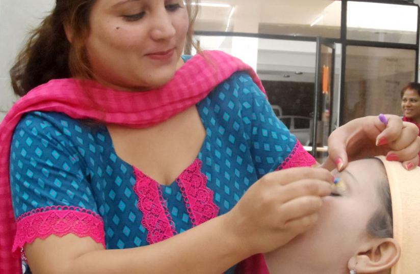 Rahma administers a facial treatment. (Moses Opobo)