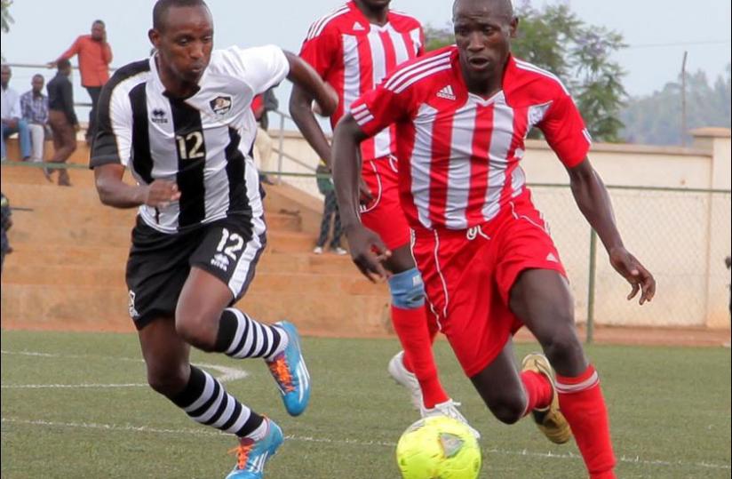 APRu00e2u20acu2122s Jean Claude Iranzi  (L) scored his sideu00e2u20acu2122s second goal. The Champions are top of the National Football league. (John Mbanda)