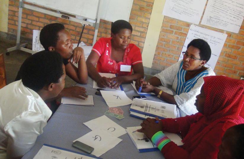 Some of the women who attended the training in a group discussion on how to attract customers. (Peterson Tumwebaze)