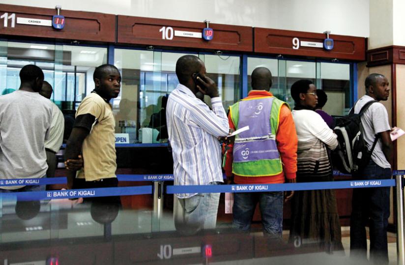 Bank of Kigali customers wait to carry out transactions. ( File)