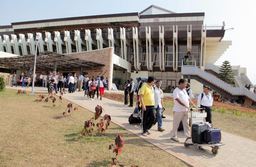 Passengers leave the arrivals section of Kigali International Airport. (John Mbanda)