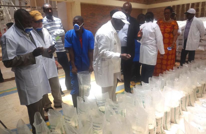 Agriculture minister Mukeshimana (extreme right) and her delegation at Kirehe rice factory on Monday. (Stephen Rwembeho)