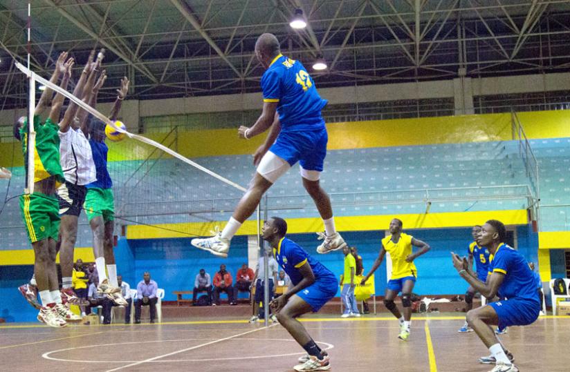 Team captain Aimable Mutuyimana spikes the ball against the select side during the warm-up game on Wednesday. (T. Kisambira)