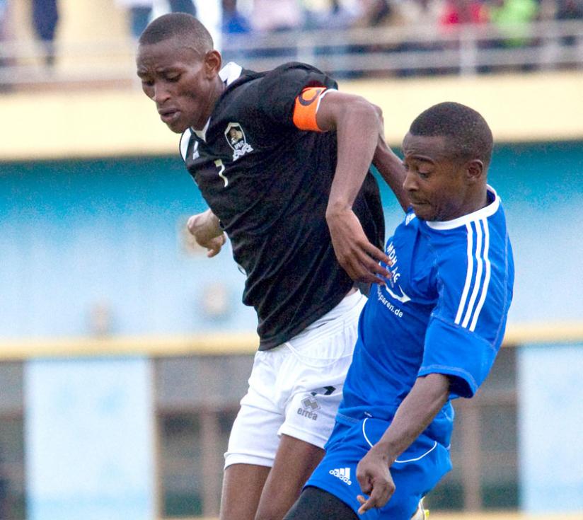 APR midfielder Jean Baptiste Mugiraneza, left, battles for possession with Rayon Sportsu00e2u20acu2122 Fuadi Ndayisenga during a previous league match at Amahoro stadium. (File)