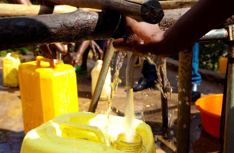 People draw water iin Karongi District. Minirena is seeking to maximise exploitation of water resources in the country. (File)