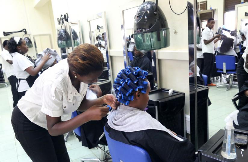 A student attends to a client at SHAIR academy. (John Mbanda)