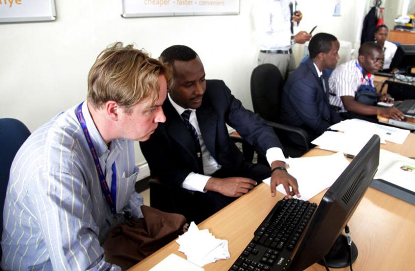 An investor (L) is guided on how to register business at RDB last year. (File)