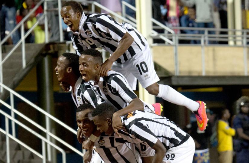 APR players celebrate Patrick Sibomana's winner yesterday. APR are now top of the league. (Timothy Kisambira)