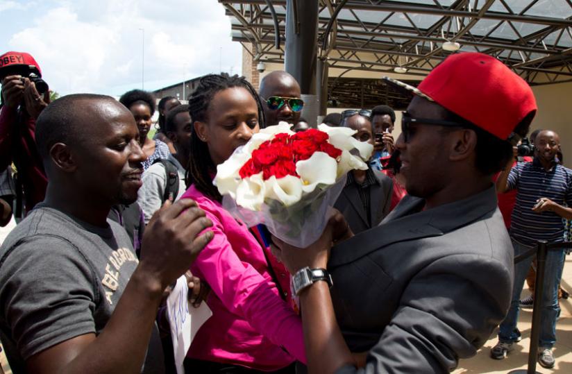 Upon arrival at Kigali International Airport, Arthur Nkusi is welcomed by family and friends. (Timothy Kisambira) 