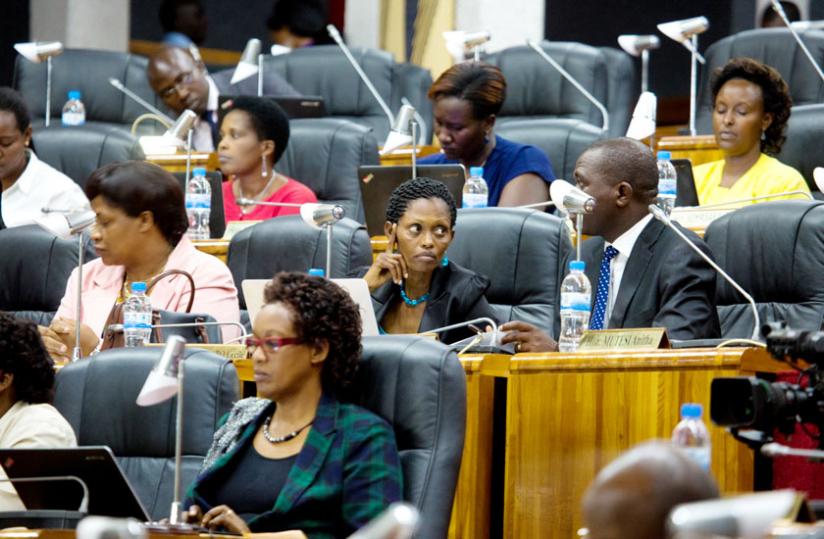 Legislators during a session. Parliament is seeking to amend the law on investments to give investors more incentives. (Timothy Kisambira)