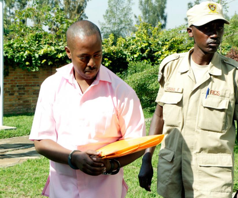 Kizito being brought to court yesterday. (John Mbanda)