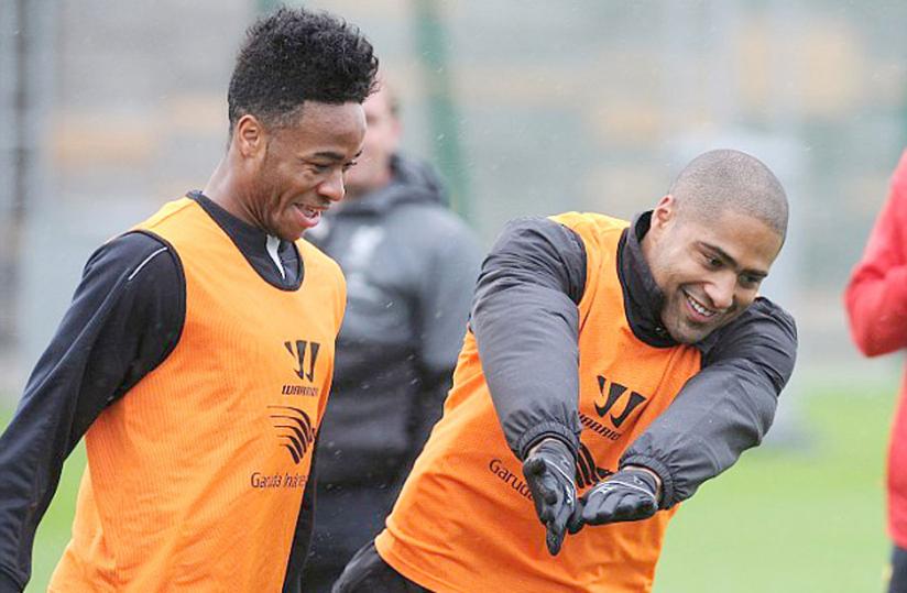 Raheem Sterling (left) and Glen Johnson share a joke as Liverpool prepare to host Jose Mourinho's side. (Internet photo)