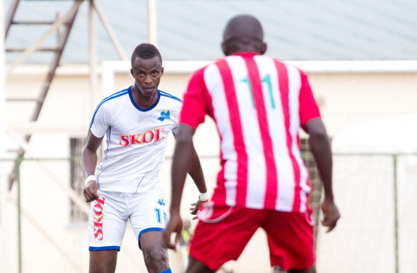 Rayon Sports defender Faustin Usengimana (L) in a league tie against Musanze. Bralirwa refused to renew sponsorship because the club is sponsored by rivals Skol. (T. Kisambira)