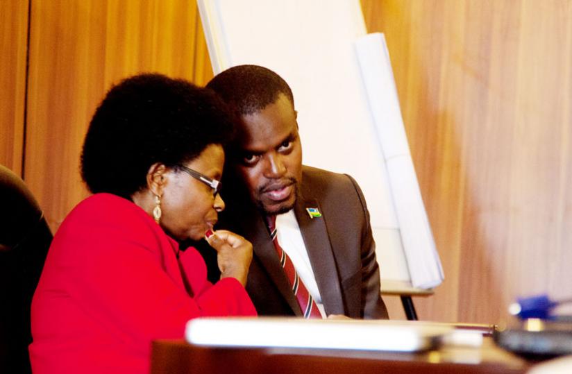 Mukagashugi (L) and Mutangana consult during the meeting in Kigali yesterday (Doreen Umutesi)