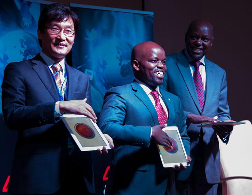 (L-R) Youngsuk Jeon, Jean-Philbert Nsengimana , and Steven Mutabazi, excitedly launch 4G LTE. (Doreen Umutesi)