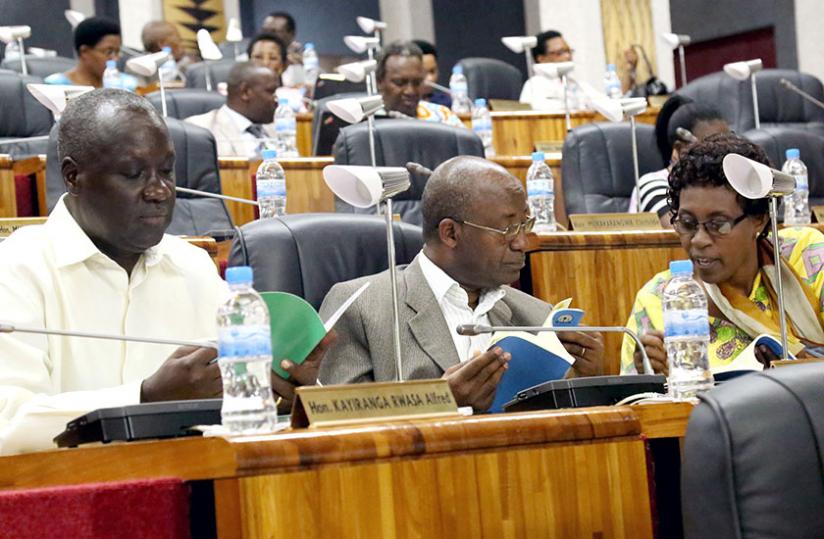 Legislators scrutinise the Ombudsman's report recently. (John Mbanda)