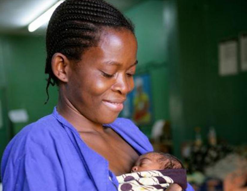 A woman uses Kangaroo Mother Care method to care for a premature baby. (Unicef photo)