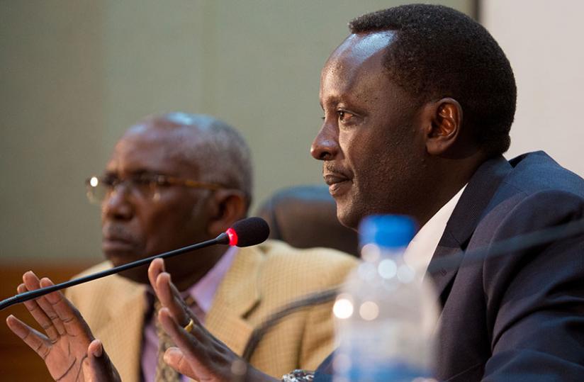 The commission chairperson Martin Ngoga, a former prosecutor-general (R), and member Christophe Mfizi, the dean of the School of Journalism at the Catholic Institute of Kabgayi,  during yesterdayu00e2u20acu2122s news briefing at Telecom House in Kacyiru yesterday. (Timothy Kisambira)