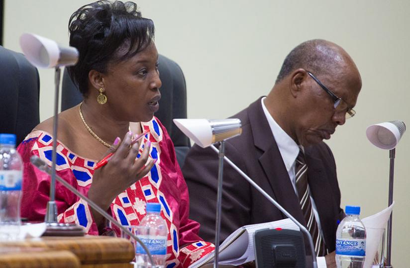 Madeleine (L), with Niyonzima Etienne, a commissioner in  Parliament last month.(T.Kisambira)