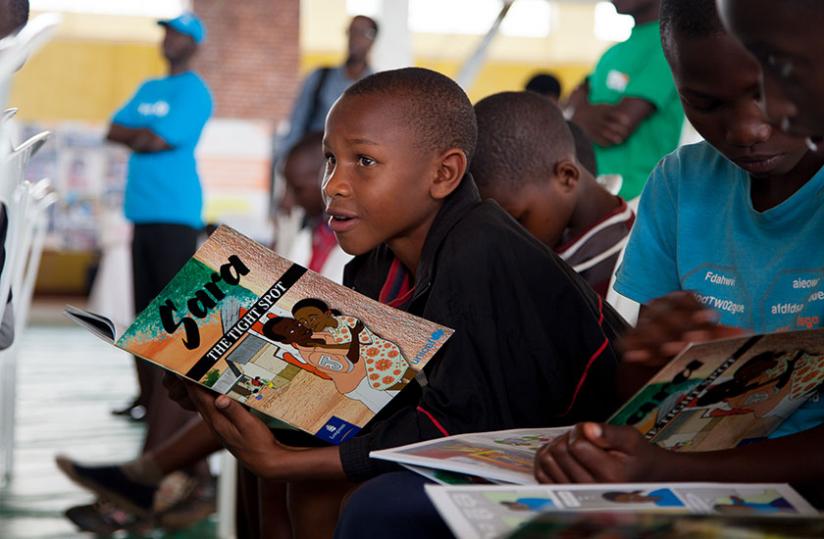 Children were given books to read during the celebrations. (Doreen Umutesi)