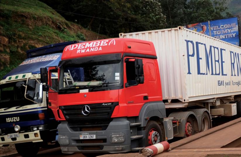 Ugandan-registered cargo trucks enter Rwanda at Gatuna border post. Local logistics industry players say they are being forced out of business by regional transporters; a situation that influenced the Cabinet decision to lift government ban on importation of RHD heavy trucks. File photo.