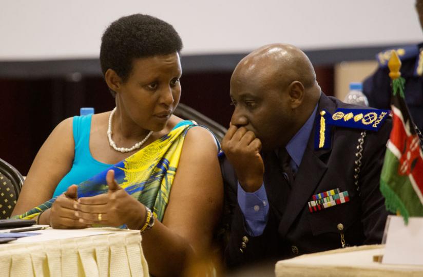 Gender and Family Promotion minister Oda Gasinzigwa chats with IGP Emmanuel Gasana at the annual General Assembly of the Kigali International Conference Declaration (KICD) in Kigali yesterday.(Timothy Kisambira)