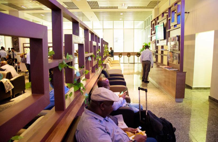 Passengers wait for a flight in the new lounge at Kigali International Airport yesterday. (Timothy Kisambira)