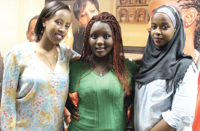 Umunyana (left) poses for a photo with Umugwaneza and Kirezi at Airtel offices on Monday. (Courtesy)