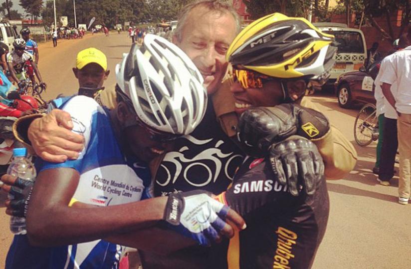 Ndayisenga (L) is congratulated by Team Rwanda head coach Jonathan u00e2u20acu02dcJocku00e2u20acu2122 Boyer (C) and Adrien Niyonshuti (R) after the 20-year-old clinched the National Championships in July this year. (Courtesy photo)