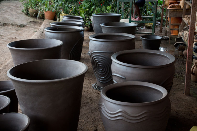 The pots are left to dry before being baked. (Timothy Kisambira)