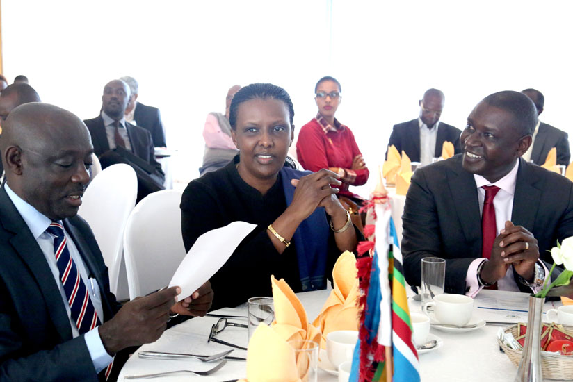 Gasamagera (R) with EAC Affairs minister Valentine Rugwabiza (C) and East African Business Council vice chairman Denis Karera at a recent meeting in Kigali. (Courtesy)