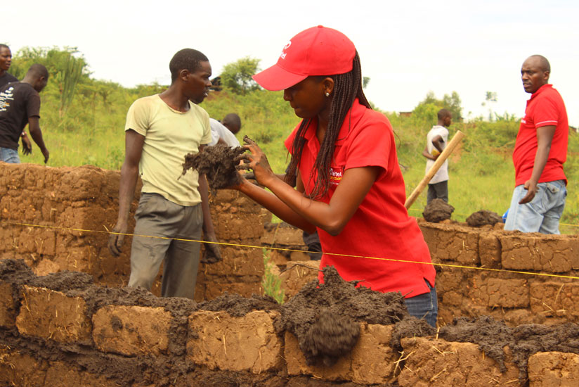 Some of the telecomu00e2u20acu2122s employees who participated in building houses for the refugees. 