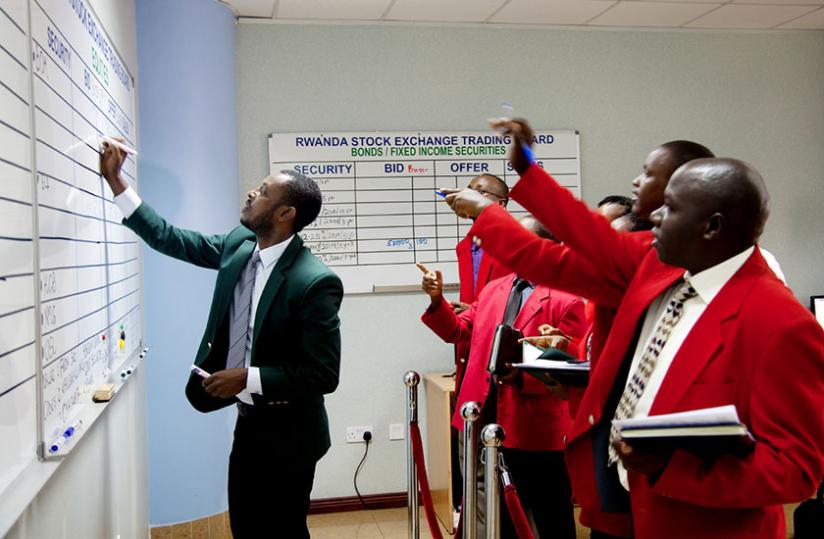 A broker lists the trading of the Treasury bond at Rwanda Stock Exchange in Kigali yesterday. (Doreen Umutesi)