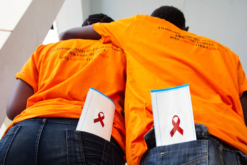 Youth show off the HIV sign at a past event. (Timothy Kisambira)