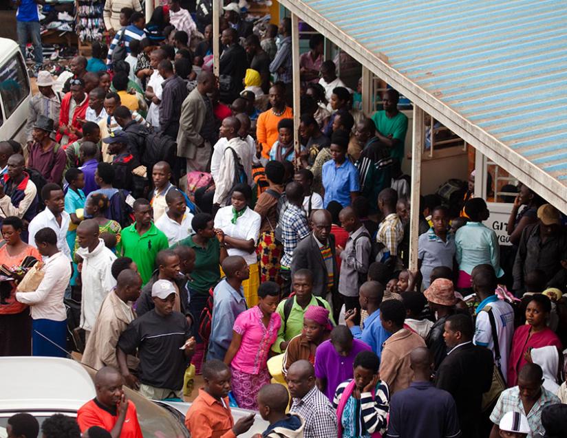 Passengers headed for upcountry destinations are seen stranded at Nyabugogo Bus Terminal in this  December 31, 2013 photo.  Transport companies were allocated different highways to avoid shortages. (Timothy Kisambira) 