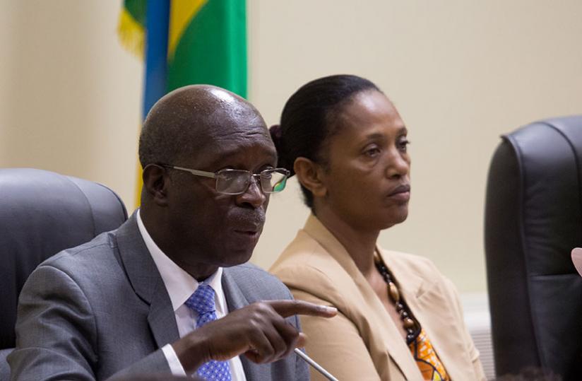 Prime Minister Murekezi stresses a point as deputy president of the Senate Jeanne du00e2u20acu2122Arc Gakuba looks on at Parliament yesterday. (Timothy Kisambira)