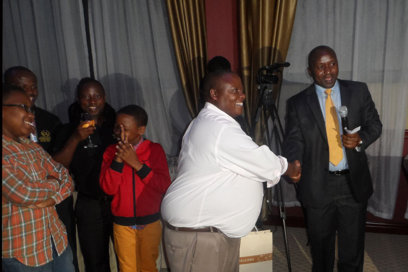 A lucky winner receives his Christmas gift hamper.