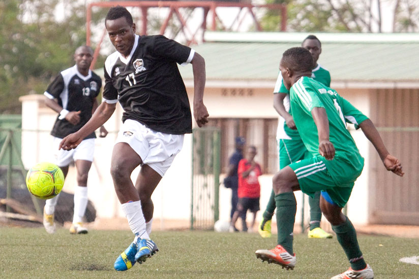 Charles Tibingana, left, seen here in action against Kiyovu, is desparate to play as he is currently just training with APR. (File photo)