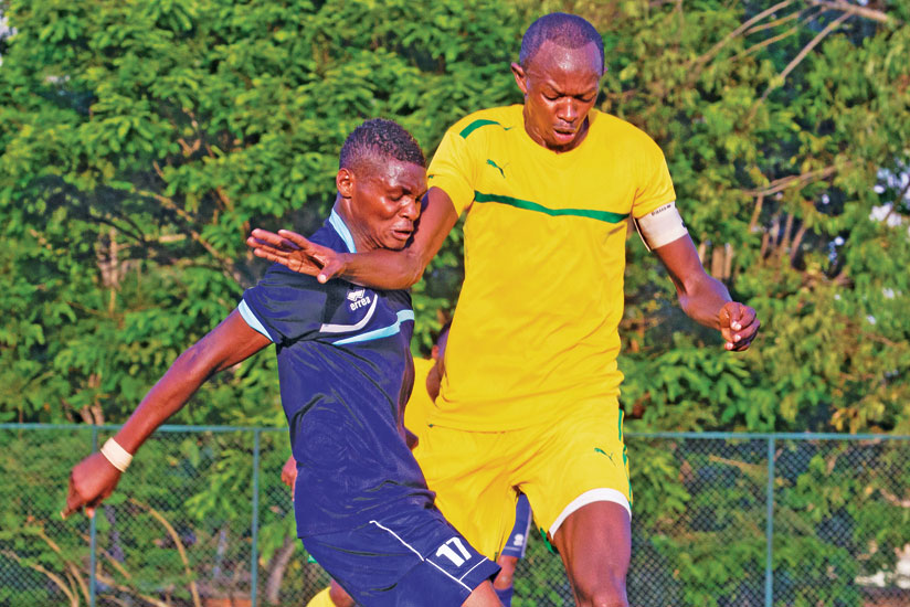 AS Kigali captain Jean Pierre Mabula, right, tussles with Police striker Emmanuel Sebanani during this season's league clash which ended 0-0. (T. Kisambira)