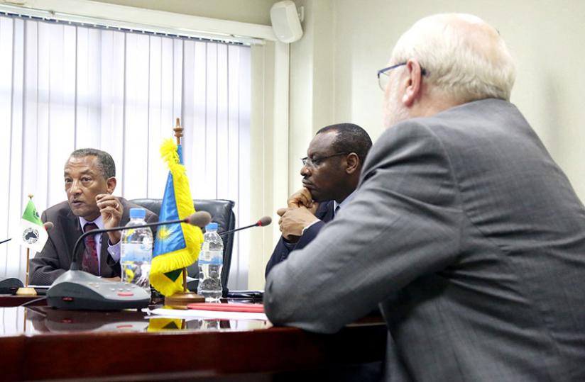 Negatu Makonnen (L), the African Development Bank country representative, briefs the media after the bank and government signed the funding agreement in Kigali yesterday, as Finance minister Claver Gatete and University of Rwanda Vice-Chancellor, Prof. James McWha, look on.(John Mbanda)