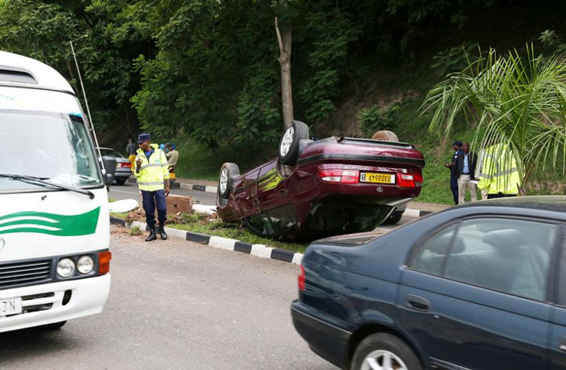 An officer directs traffic at a scene of accident on Airport Road in Kigali last month. (John Mbanda)