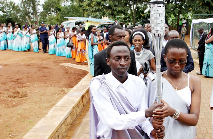 A procession of the Kwibuka Flame in Kicukiro District during the commemoration of the 20th anniversary of the 1994 Genocide against Tutsi earlier this year. (John Mbanda)