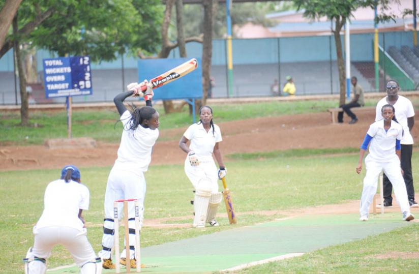 Betty Mukunzi (R), who plays for White Clouds CC, bowls against Queens of Victory captain Jeanne d'Arc Sibo (L) during a league game. (File)