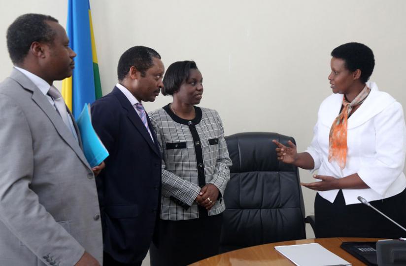 L-R; State Minister for Finance and economic planning Uziel Ndagijimana, CEO, Rwanda Governance Board  Anastase Shyaka, Minister for the Presidency Venantie Tugireyezu and Gender Minister Oda Gasinzigwa chat after the press conference yesterday. (John Mbanda)