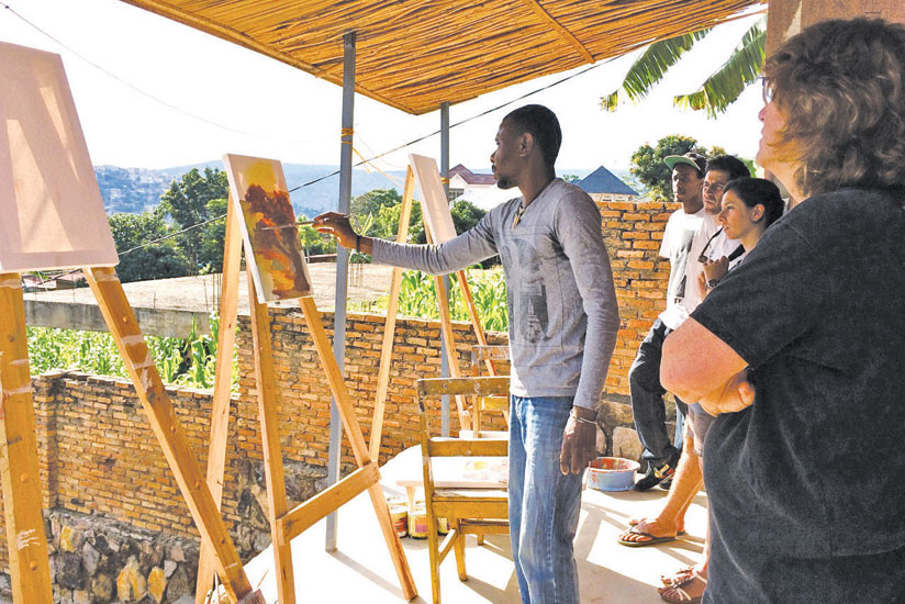 Joe Mukuna teaches a painting class.