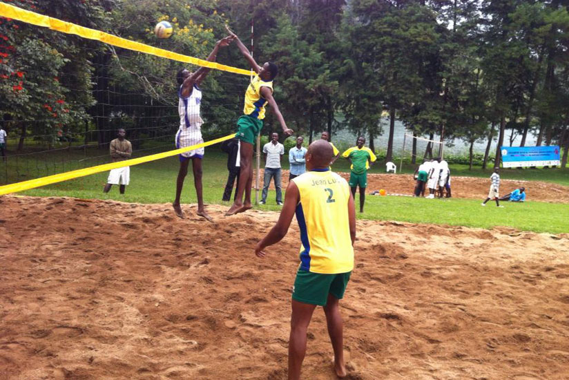 Flavien Ndamukunda spikes the ball during a beach volleyball game recently. The 25 year old is confident of winning the National Championship today. (Courtesy)